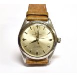 A GENT'S VINTAGE TUDOR OYSTER ELEGANTE STEEL WATCH on leather strap, round steel dial to steel head,