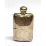 A SILVER SPIRIT FLASK the solid silver spirit flask with pull-off bottom section with silver gilt