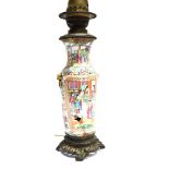 A CHINESE CANTON FAMILLE VERTE VASE CONVERTED TO LAMP the reserves painted with figures in a court