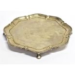 A SMALL SILVER TRAY of hexagonal shape on four pad feet, 20cm across, hallmarks for Sheffield