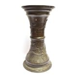 AN ORIENTAL BRONZE JARDINIERE STAND of waisted cylindrical form, relief decorated with cranes and