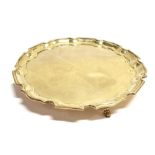 A SMALL SILVER TRAY On three pad feet with lobed border and rim of plain form, 21cm diameter,