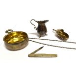 THREE SMALL ITEMS OF SILVER comprising a modern wine taster with double snake loop handle and gilt