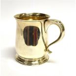 A SILVER MUG OF PLAIN BALUSTER FORM On pedestal base, kick out handle terminal 11cms high,