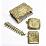 FOUR ITEMS OF SMOKING RELATED SILVER comprising a silver cased amber cigarette holder, two vesta