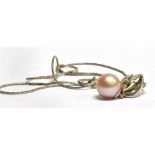 AN 18 CARAT WHITE GOLD PENDANT SET WITH A SINGLE PINK CULTURED PEARL DROP with a small diamond above