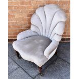 AN EARLY VICTORIAN SHELL SHAPED UPHOLSTERED ARMCHAIR on spiral turned rosewood front supports,
