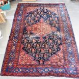 A BLUE GROUND RUG with central medallion and botehs, 140cm x 215cm