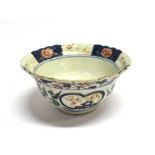 A JAPANESE PORCELAIN BOWL with lobed and flared rim, the exterior decorated with thistles, the