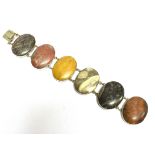 A VICTORIAN SILVER AGATE SET BRACELET the six flat oval cabochon cut stones comprising assorted