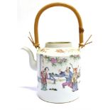 A CHINESE PORCELAIN TEAPOT painted decoration of figures in a garden, 15cm high excluding bamboo