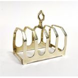 A SMALL SILVER TOAST RACK the four slice toast rack of cut-corner arched form, maker Edward Viner