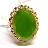 A 14CT YELLOW GOLD GREEN STONE SET DRESS RING size N ½ gross weight 3.6 grams, stamped 14k.