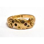 A 15 CARAT GOLD BAND RING hallmarked Chester 1900, small ruby to front scroll section (note the