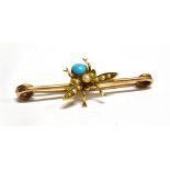 AN EDWARDIAN TURQUOISE AND SEED PEARL SET FLY BAR BROOCH/PIN assessed as 9 carat yellow gold