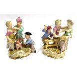 A PAIR OF 19TH CENTURY CONTINENTAL PORCELAIN GROUPS OF CHILDREN on gilt decorated rococo bases