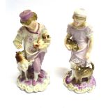 A PAIR OF CONTINENTAL MEISSEN STYLE HARD PASTE FIGURES on rococo style bases bearing underglaze blue