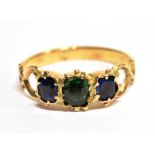 A GREEN GARNET AND BLUE STONE THREE STONE RING the central old cut green garnet approx. 5mm x 4mm,