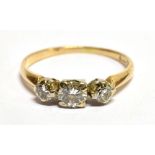 A DIAMOND THREE STONE 18 CARAT GOLD RING three round brilliant cut diamonds weighing approx. 0.50