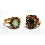 TWO 9 CARAT GOLD DRESS RINGS comprising an opal and synthetic ruby oval cluster and a red stone oval