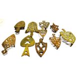 A GROUP OF TEN VARIOUS VICTORIAN BRASS TRIVETS