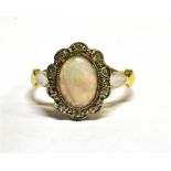 AN OPAL AND DIAMOND OVAL CLUSTER 18 CARAT GOLD RING central cabochon cut precious opal, 18 carat