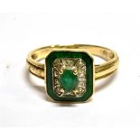 A 14 CARAT GOLD EMERALD AND SMALL DIAMOND SET RECTANGULAR CLUSTER RING the cut corner head