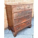 AN OAK CHEST OF TWO SHORT AND THREE LONG DRAWERS on bracket feet, 88cm wide 52cm deep 107cm high