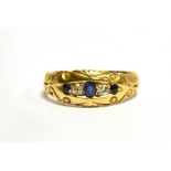 AN 18 CARAT GOLD SAPPHIRE AND DIAMOND 5 STONE BOAT HEAD RING scroll decoration, hallmarked 18