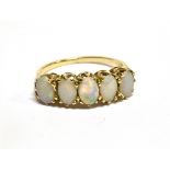 AN OPAL FIVE STONE 9 CARAT GOLD RING five cabochon opals claw set to a yellow gold shank, ring