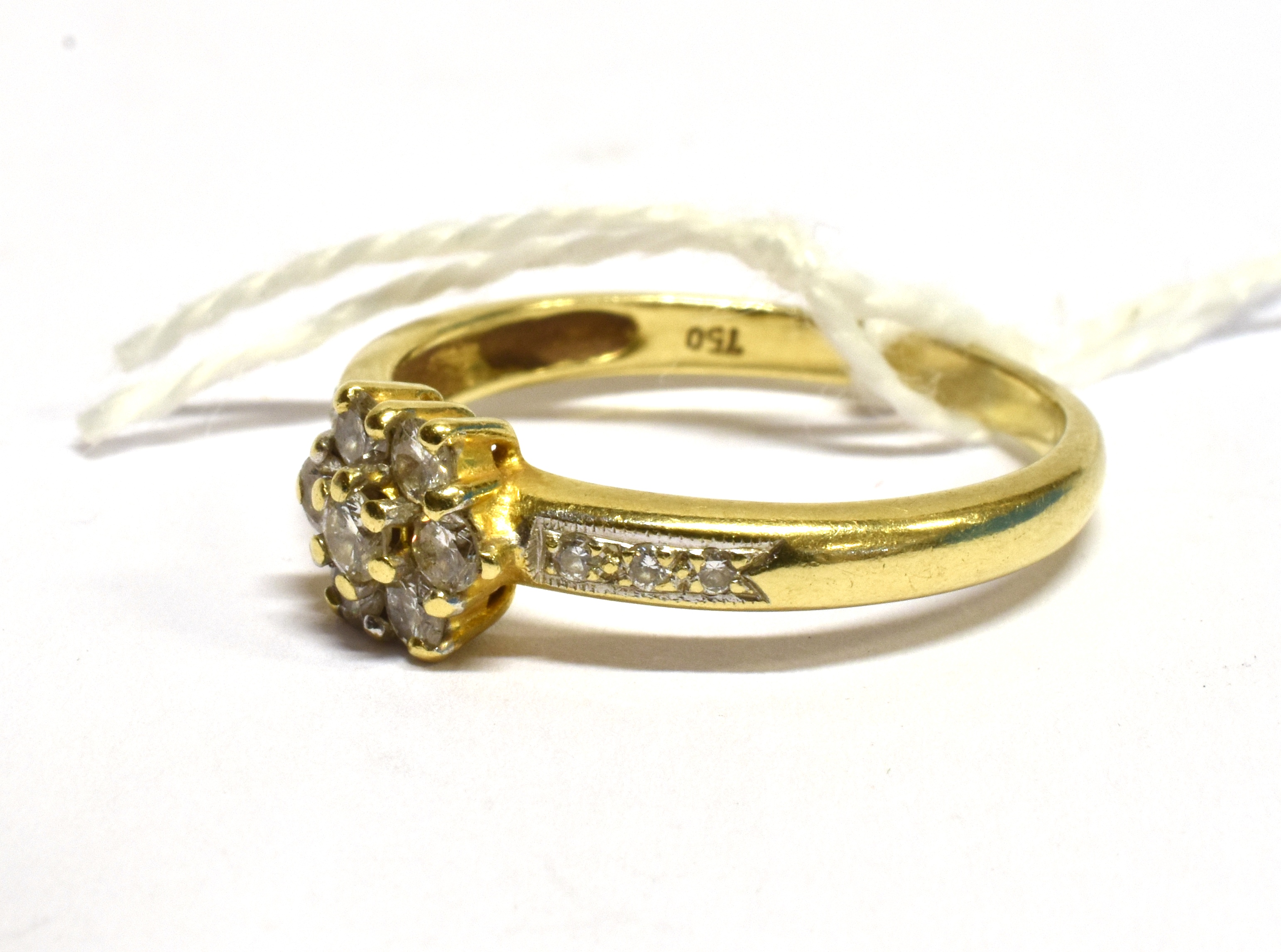 A DIAMOND FLOWER HEAD CLUSTER 18 CARAT GOLD RING the flower head cluster comprising seven round - Image 3 of 3
