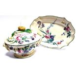 A 19TH CENTURY CONTINENTAL FAIENCE TUREEN AND COVER and matching dish, the dish 43cm wide