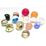 A GROUP OF FOURTEEN GLASS PAPERWEIGHTS including Caithness 'Inner Circle'