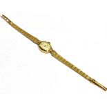 A LADIES VINTAGE 9CT GOLD BRACELET WATCH small barrel shaped dial and head, winding mechanical