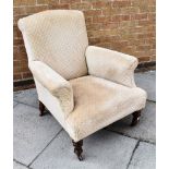 A VICTORIAN UPHOLSTERED ARMCHAIR with scroll arms, on turned supports