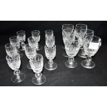 A SET OF SIX WATERFORD CRYSTAL 'COLLEEN' PATTERN SHERRY GLASSES 10.5cm high, and 11 liqueur