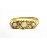 AN 18 CARAT GOLD OPAL THREE STONE AND DIAMOND SET BOAT HEAD RING hallmarked 1963, ring size N ½,