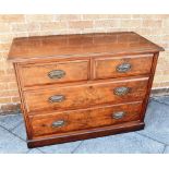 AN EDWARDIAN WALNUT CHEST OF TWO SHORT AND TWO LONG DRAWERS on plinth base, 107cm wide 49cm deep