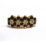 A DIAMOND AND SAPPHIRE FOUR CLUSTER 9 CARAT GOLD DRESS RING ring size L, gross weight 2.7 grams.