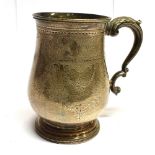 A VICTORIAN EXETER SILVER MUG of traditional baluster form on pedestal base with double scroll
