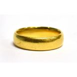 A HALLMARKED 22CT PLAIN WEDDING BAND of D profile section, 5mm wide, ring size O, weight approx. 7.2