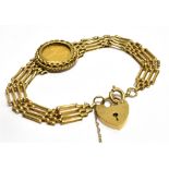 A 9 CARAT GOLD ONE TENTH BRITANNIA GOLD COIN SET FOUR BAR GATE BRACELET WITH PADLOCK FASTENER the