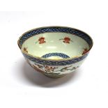 A CHINESE PORCELAIN BOWL the extrerior decorated with a tiger and bird amongst landscape, on a '