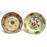 A CHINESE EXPORT ARMORIAL PLATE 22.5cm diameter, and another with floral decoration in the Famille