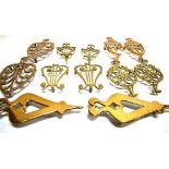 SIX PAIRS OF VICTORIAN BRASS TRIVETS