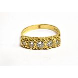 A DIAMOND FIVE STONE 18 CARAT GOLD RING boat shaped head, carved claw set with five graduating round