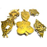 SIX PAIRS OF VICTORIAN BRASS TRIVETS