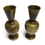 A PAIR OF TURNED SERPENTINE VASES of baluster form with flared trumpet rims, 21cm high