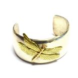 A TIFFANY & CO DRAGONFLY BANGLE The silver bangle with applied 18 carat yellow gold dragonfly,