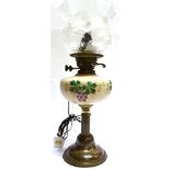 AN EDWARDIAN OIL LAMP CONVERTED TO TABLE LAMP with opaque glass reservoir and frosted and clear